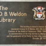 Dedication wall plaque by the library's main entrance.